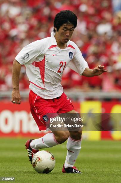 Ji Sung Park of South Korea runs with the ball during the FIFA World Cup Finals 2002 Quarter Finals match between Spain and South Korea played at the...