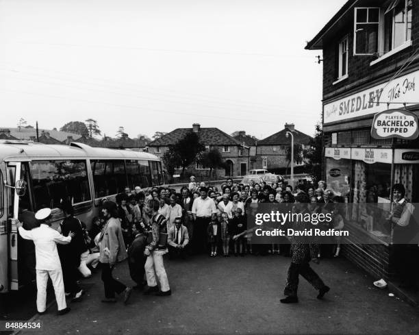 John Lennon, George Harrison and Paul McCartney walk back to their coach after a visit to Smedley's fish and chip shop in Taunton, Somerset on their...