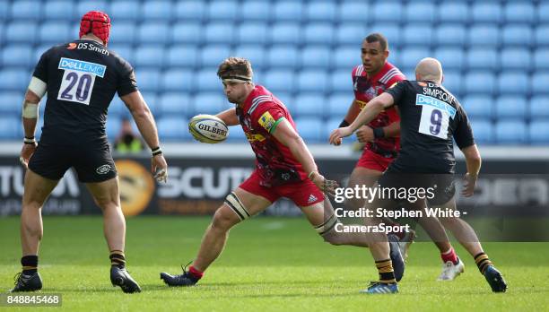 Harlequins' Jack Clifford is tackled by Wasps' James Haskell and Joe Simpson during the Aviva Premiership match between Wasps and Harlequins at The...