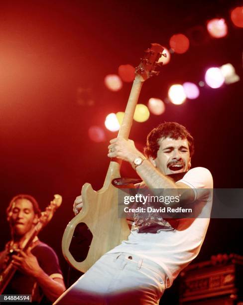 Mexican born American guitarist Carlos Santana performs live on stage with the rock group Santana in London during the Welcome tour in November 1973....