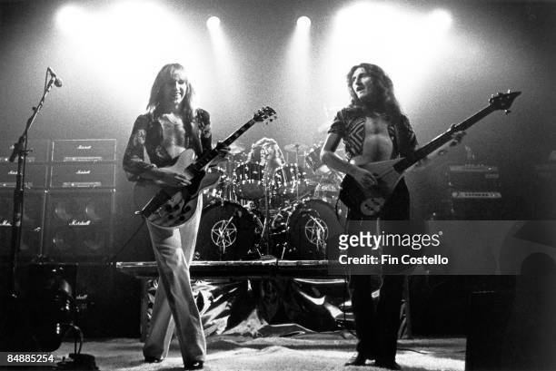 Photo of Geddy LEE and Alex LIFESON and RUSH, Alex Lifeson, Neil Peart & Geddy Lee performing live onstage on All The World's A Stage tour