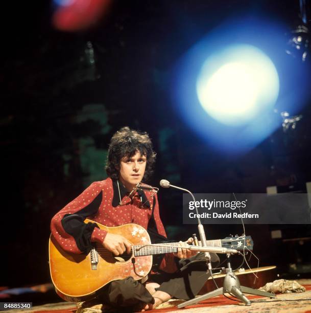 Scottish singer and musician Donovan plays an acoustic guitar on a BBC television show in London in August 1972.