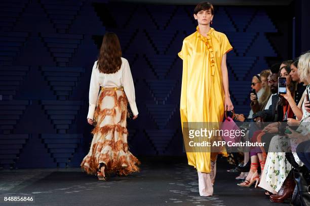 Models present creations from Serbian designer Roksanda Ilincic during a catwalk show for the Spring/Summer 2018 collection on the fourth day of The...