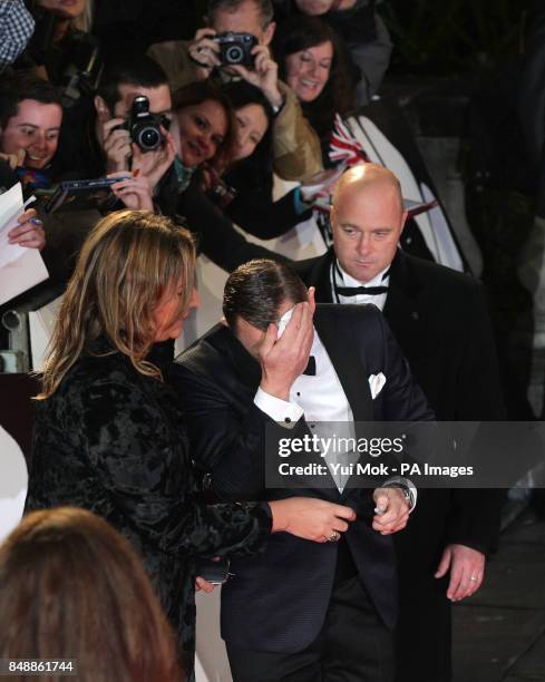 Daniel Craig mops his brow during the world premiere of Skyfall, at the Royal Albert Hall in London.