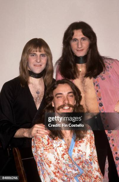 Photo of RUSH, L-R: Alex Lifeson, Neil Peart, Geddy Lee - posed, group shot