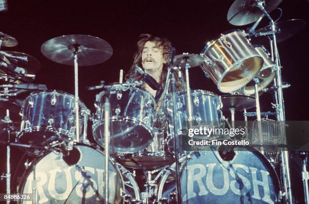 Photo of Neil PEART and RUSH; Neil Peart performing live onstage on All The World's A Stage tour,