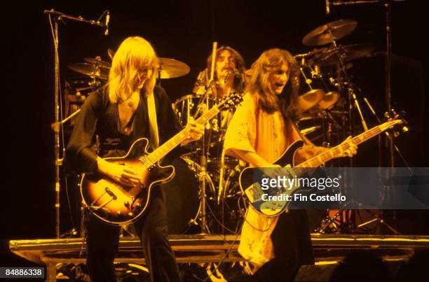 Photo of Geddy LEE and Alex LIFESON and RUSH; L-R: Alex Lifeson, Neil Peart, Geddy Lee performing live onstage on All The World's A Stage tour,