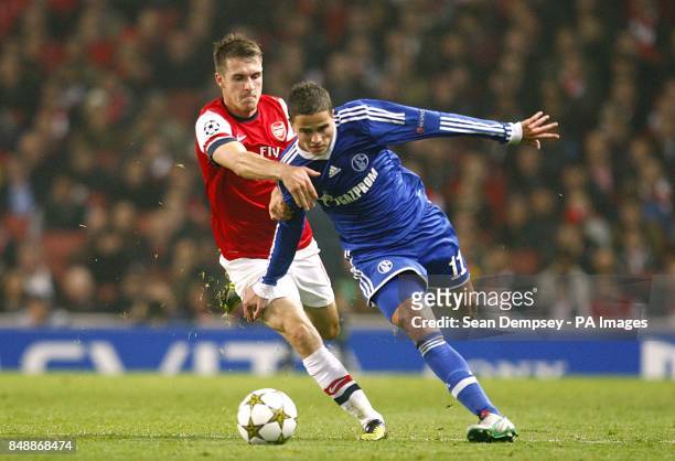 Schalke 04's Ibrahim Afellay and Arsenal's Aaron Ramsey battle for the ball