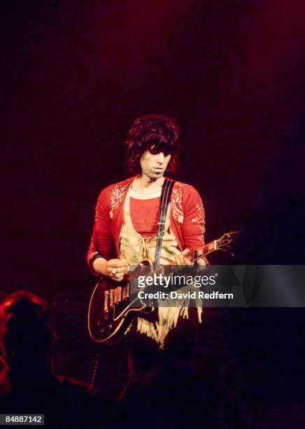 English guitarist Keith Richards of The Rolling Stones performs live on stage playing a Gibson Les Paul Custom guitar at Colston Hall in Bristol,...