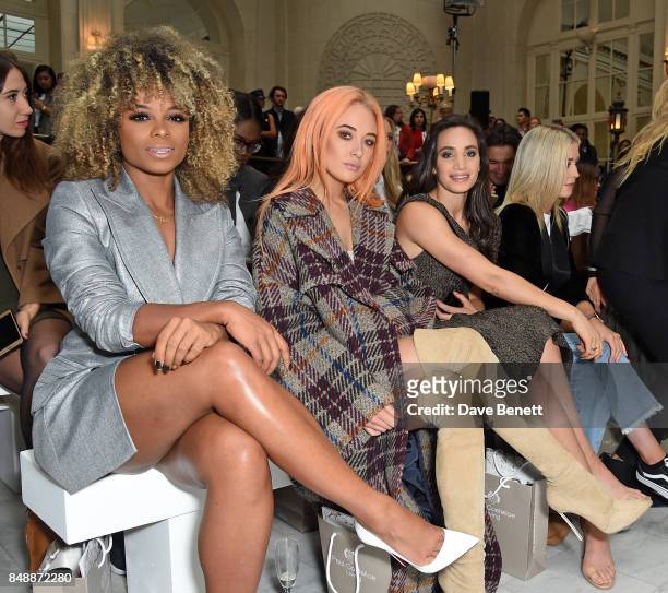 Fleur East, Nicola Hughes and Laura Wright attend the Paul Costelloe catwalk show during London Fashion Week at The Waldorf London on September 18,...
