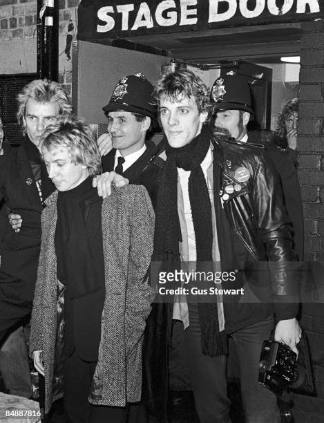 Photo of Andy SUMMERS and Stewart COPELAND and STING and POLICE, L-R: Sting, Andy Summers, Stewart Copeland outside stage door - on night when they...