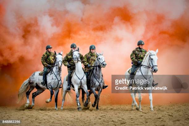 Horses of the Cavalry honorary escort are tested with noise, music and smoke during a training session the day before Prinsjesdag on September 18,...