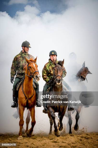 Horses of the Cavalry honorary escort are tested with noise, music and smoke during a training session the day before Prinsjesdag on September 18,...