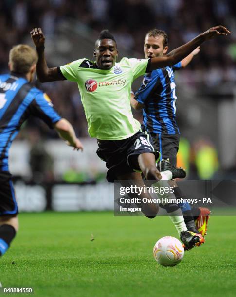 Newcastle United's Sammy Ameobie is challenged from behind by Club Brugge's Jonathan Blondel during the UEFA Europa League match at St James' Park,...