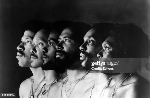 Photo of Lionel RICHIE and COMMODORES; Lionel Richie far left, posed group portrait