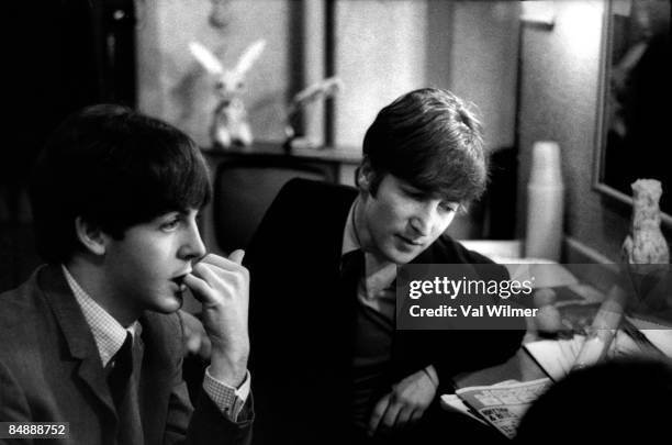 30th DECEMBER: Paul McCartney and John Lennon from The Beatles posed backstage at the Finsbury Park Astoria, London during the band's Christmas Show...