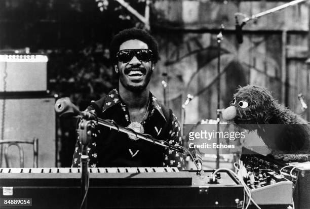 Photo of Stevie WONDER, Stevie Wonder appears on Sesame Street with S.S. Character Grover to perform Superstitious and a Sesame Street Jam. B&W !