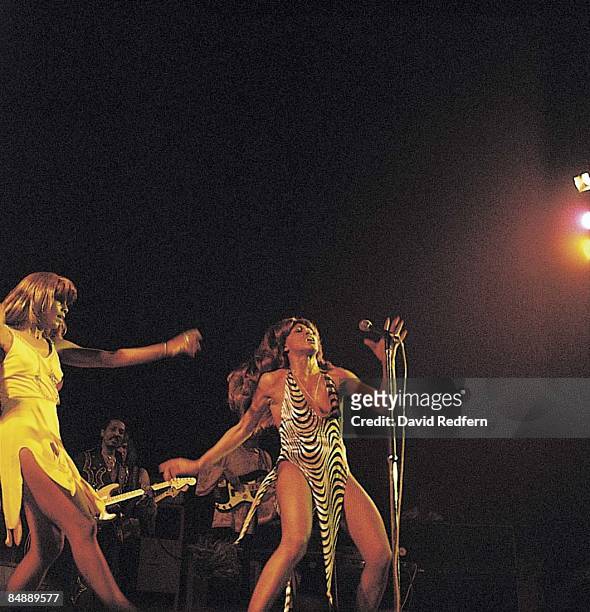 American music duo Tina Turner and Ike Turner behind, of the Ike & Tina Turner Revue perform live on stage at the Hammersmith Odeon in London on 24th...