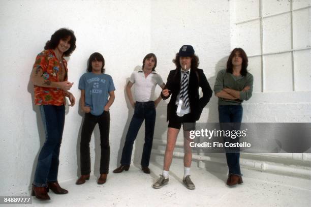 Photo of AC/DC and Cliff WILLIAMS and Bon SCOTT and Malcolm YOUNG and Angus YOUNG and Phil RUDD and AC DC, Posed studio group portrait of L-R Bon...