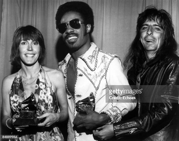 Photo of Alice COOPER and Helen REDDY and Stevie WONDER; B&W Posed, L-R Helen Reddy, Stevie Wonder, Alice Cooper back stage at the George Gershwin...
