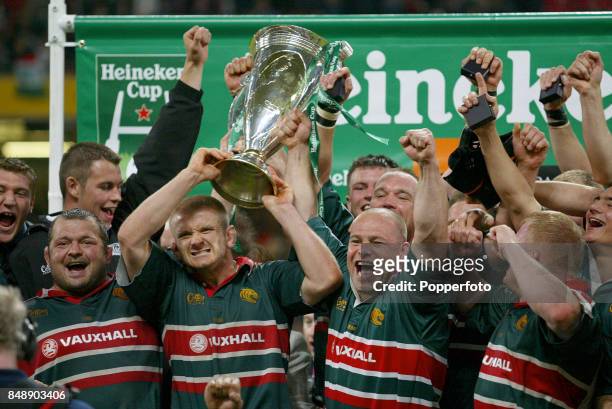 The Leicester Tigers celebrate winning the trophy following the Heineken Cup Final between Leicester Tigers and Munster at the Millennium Stadium in...