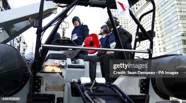 Mayor of London Boris Johnson arrives at the HMS Severn ship in South Quay, on board a Royal Navy RIB to launch the largest ever London poppy day...