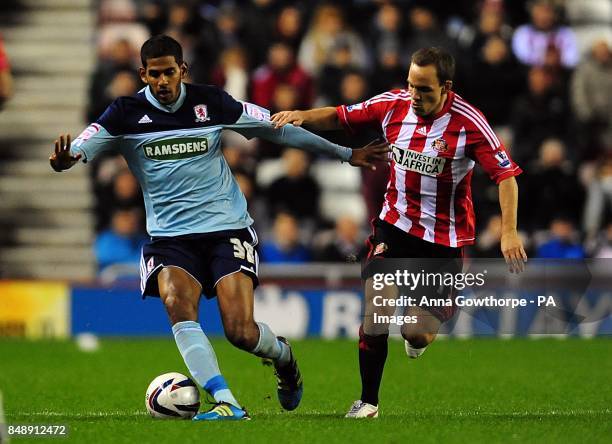 Middlesbrough's Faris Haroun and Sunderland's David Vaughan battle for the ball