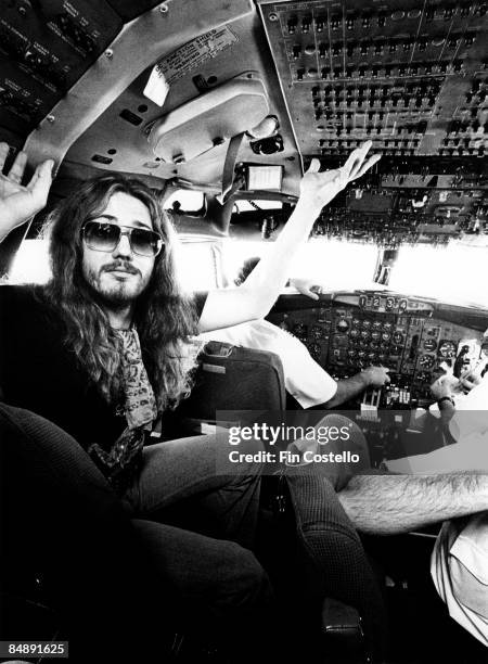 Photo of David COVERDALE and DEEP PURPLE; Deep Purple singer posed in the cockpit of their Starship plane