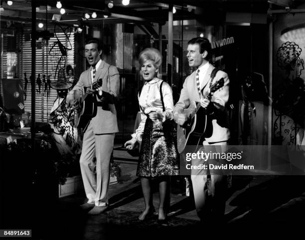 English pop folk group The Springfields, featuring from left, Mike Hurst, Dusty Springfield and Tom Springfield, perform together on a television...