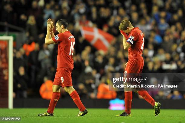Liverpool's Steven Gerrard and teammate Stewart Downing look dejected after the final whistle.