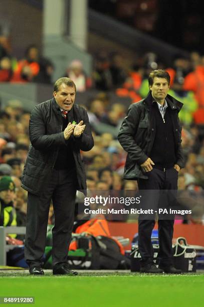 Liverpool manager Brendan Rodgers and Swansea City manager Michael Laudrup on the touchline