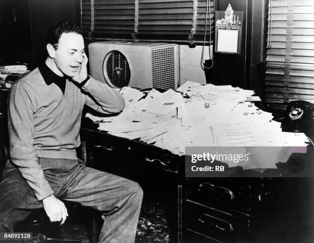 Photo of Alan FREED; Alan Freed 'Moondog' in his office