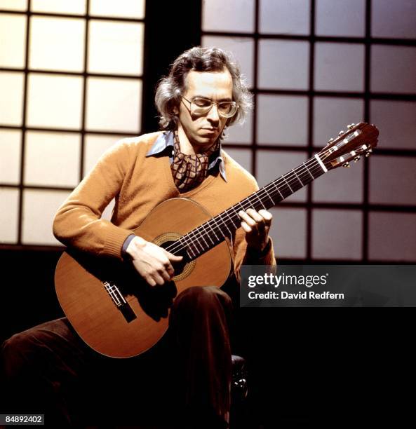 Australian classical guitarist John Williams performs on a television show in London in November 1977.