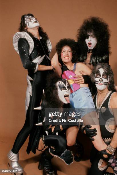 Photo of Ace FREHLEY and Gene SIMMONS and KISS and Peter CRISS and Paul STANLEY; L-R: Ace Frehley, Gene Simmons, model, Paul Stanley, Peter Criss -...