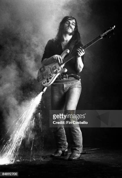 Photo of MOTORHEAD and LEMMY; Posed portrait of Lemmy, fireworks coming out of bass guitar