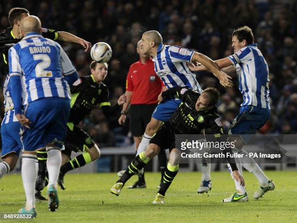 Brighton's Adam El-Abd is challenged by Leeds United's Luke Varney during the npower Football League Championship match at the AMEX Stadium, Brighton.