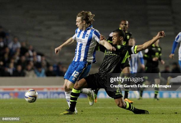 Brighton's Craig Mackail-Smith is challenged by Leeds United's Lee Peltier during the npower Football League Championship match at the AMEX Stadium,...