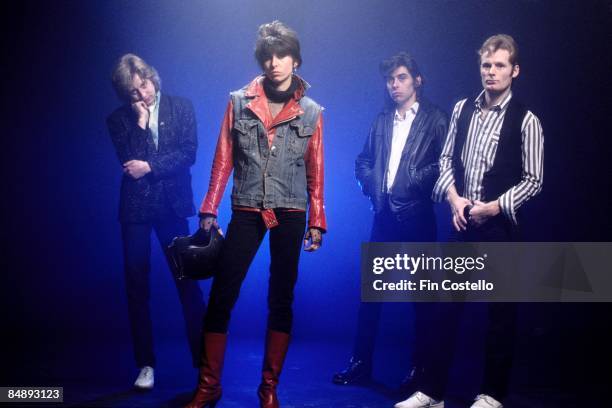 Photo of PRETENDERS and James HONEYMAN SCOTT and Chrissie HYNDE and Pete FARNDON and Martin CHAMBERS; Posed studio group portrait L-R James Honeyman...