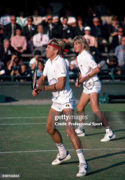 Vince Van Patten and Mel Purcell, both of the USA, in action during a men's doubles match at the Wimbledon Lawn Tennis Championships in London, circa...