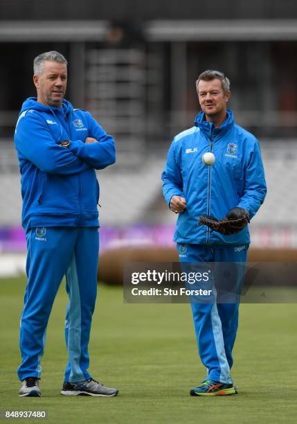 West Indies coaches Stuart Law and Toby Radford chat during their net session ahead of the Royal London Trophy against England at Old Trafford on...