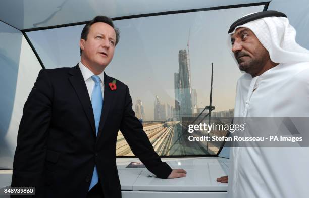 Prime Minister David Cameron takes the Dubai Metro to the World Trade Centre with His Highness Sheikh Ahmed bin Saeed al Maktoum, where he saw one of...