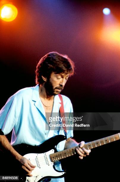 English guitarist Eric Clapton performs live on stage playing his 'Blackie' Fender Stratocaster guitar at Wembley Arena in London on 5th March 1985.