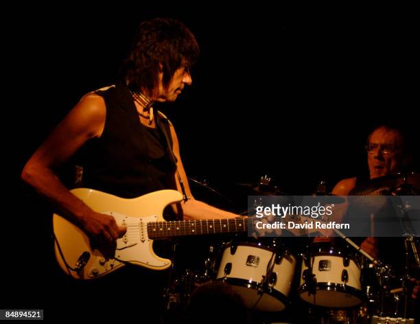 English rock guitarist Jeff Beck performs live on stage playing a Fender Signature Stratocaster guitar with drummer Vinnie Colaiuta at Ronnie Scott's...