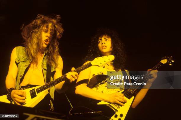 Photo of METALLICA and Kirk HAMMETT and James HETFIELD, James Hetfield and Kirk Hammett performing live onstage, playing Gibson Flying V guitars