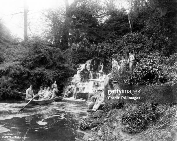 Convalescencing soldiers admire a waterfall in the grounds of Longleat House, the seat of the Marquis of Bath, which is used as a war relief hospital.