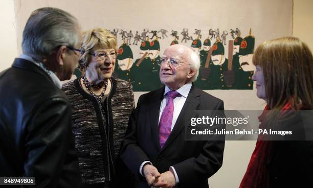 President Michael D Higgins with his wife Sabine Coyne speaking to artists Robert Ballagh and Cathy Henderson at the unveiling of the 1913 Dublin...