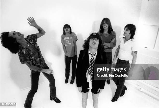 Photo of AC DC and AC/DC and Angus YOUNG and Bon SCOTT and Malcolm YOUNG and Phil RUDD and Cliff WILLIAMS, Posed studio group portrait L-R Bon Scott,...