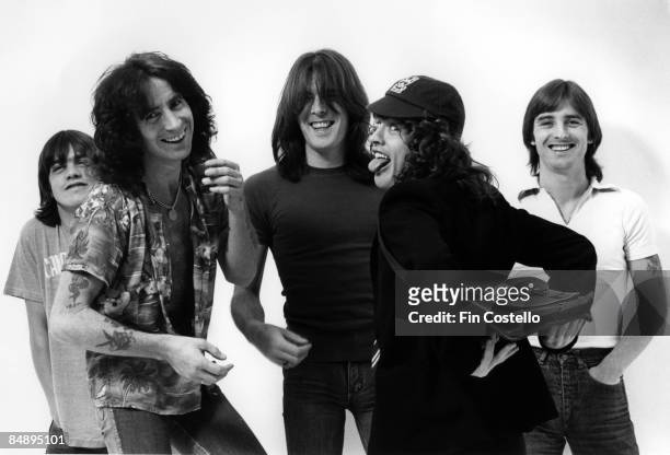Photo of AC DC and AC/DC and Angus YOUNG and Bon SCOTT and Malcolm YOUNG and Phil RUDD and Cliff WILLIAMS, Posed studio group portrait L-R Malcolm...