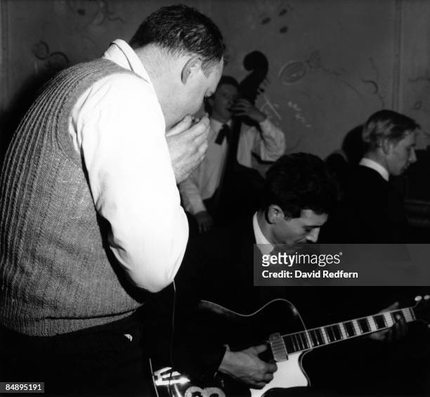 British blues guitarist Alexis Korner performs live on stage with Cyril Davies on left, double bassist Andy Hoogenboom and pianist Keith Scott at...