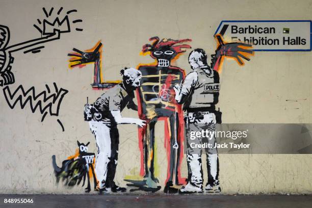 New work by street artist Banksy sits on a wall by the Barbican Centre on September 18, 2017 in London, England. The two new Banksy murals which have...